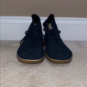Navy Clark desert boots.